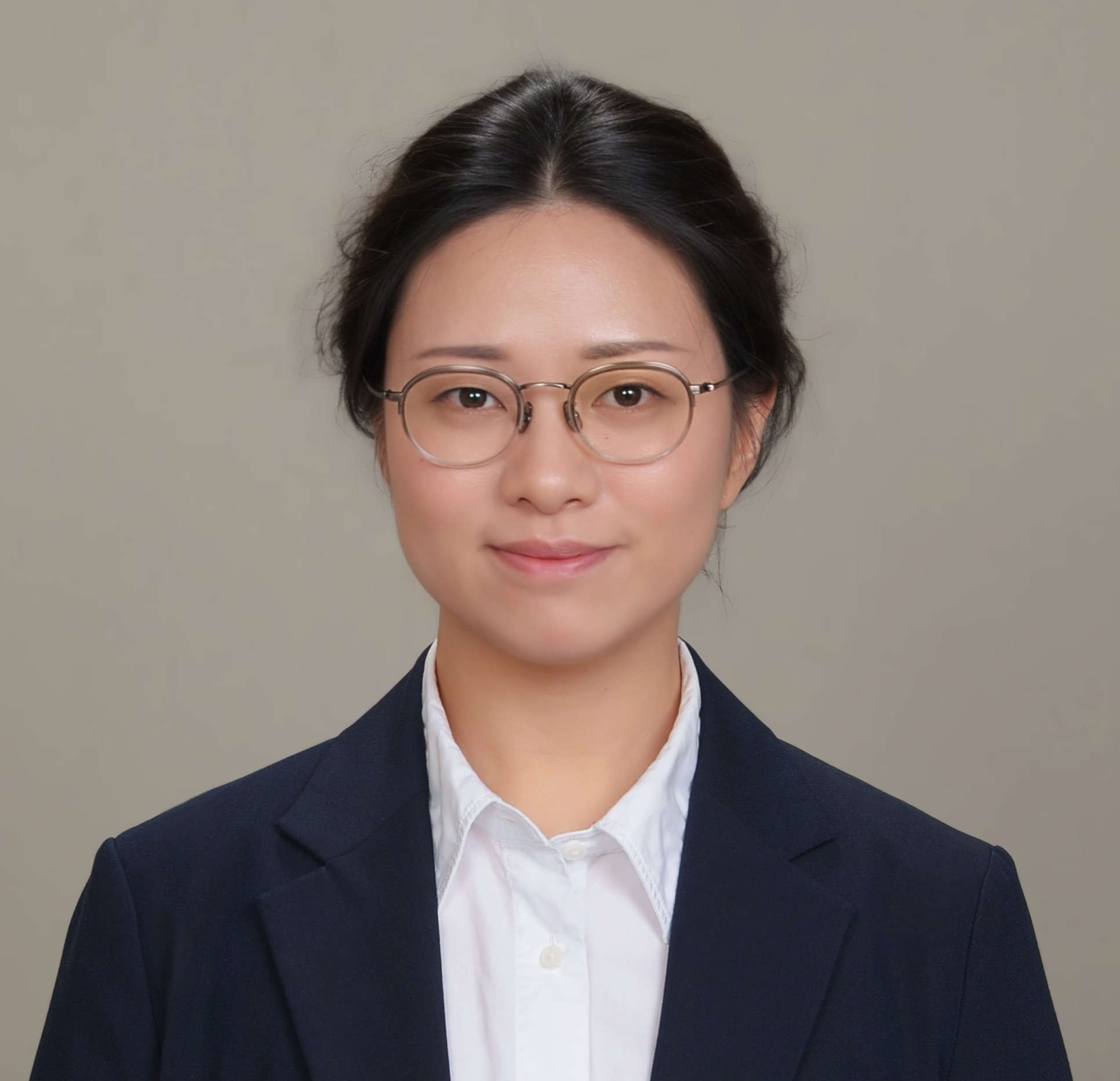Woman with black hair pulled back and glasses.