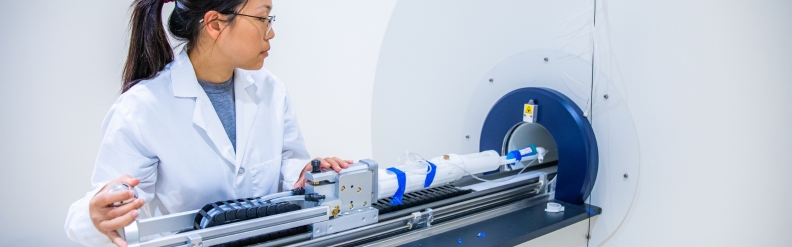 woman evaluates mri machine