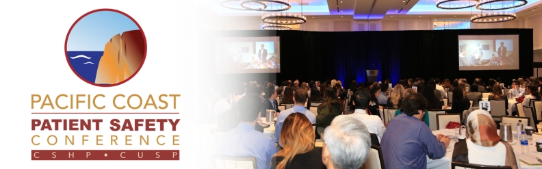 Attendees look to a presenter, PCPSC logo on the right side