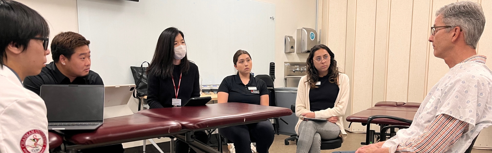 students practice with an actor