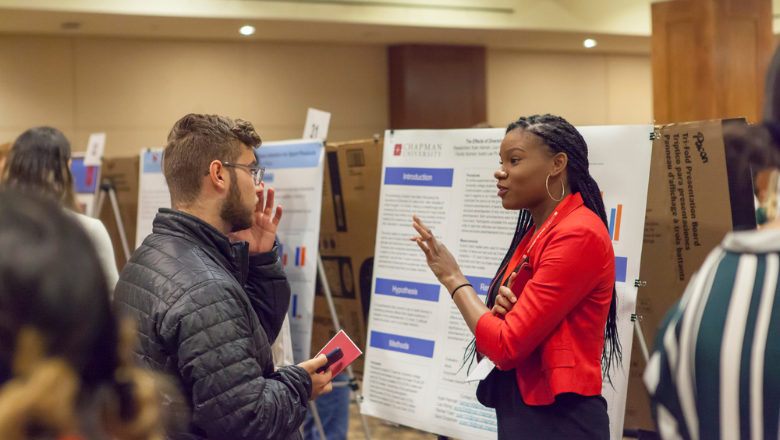 students speaking at student scholar symposium