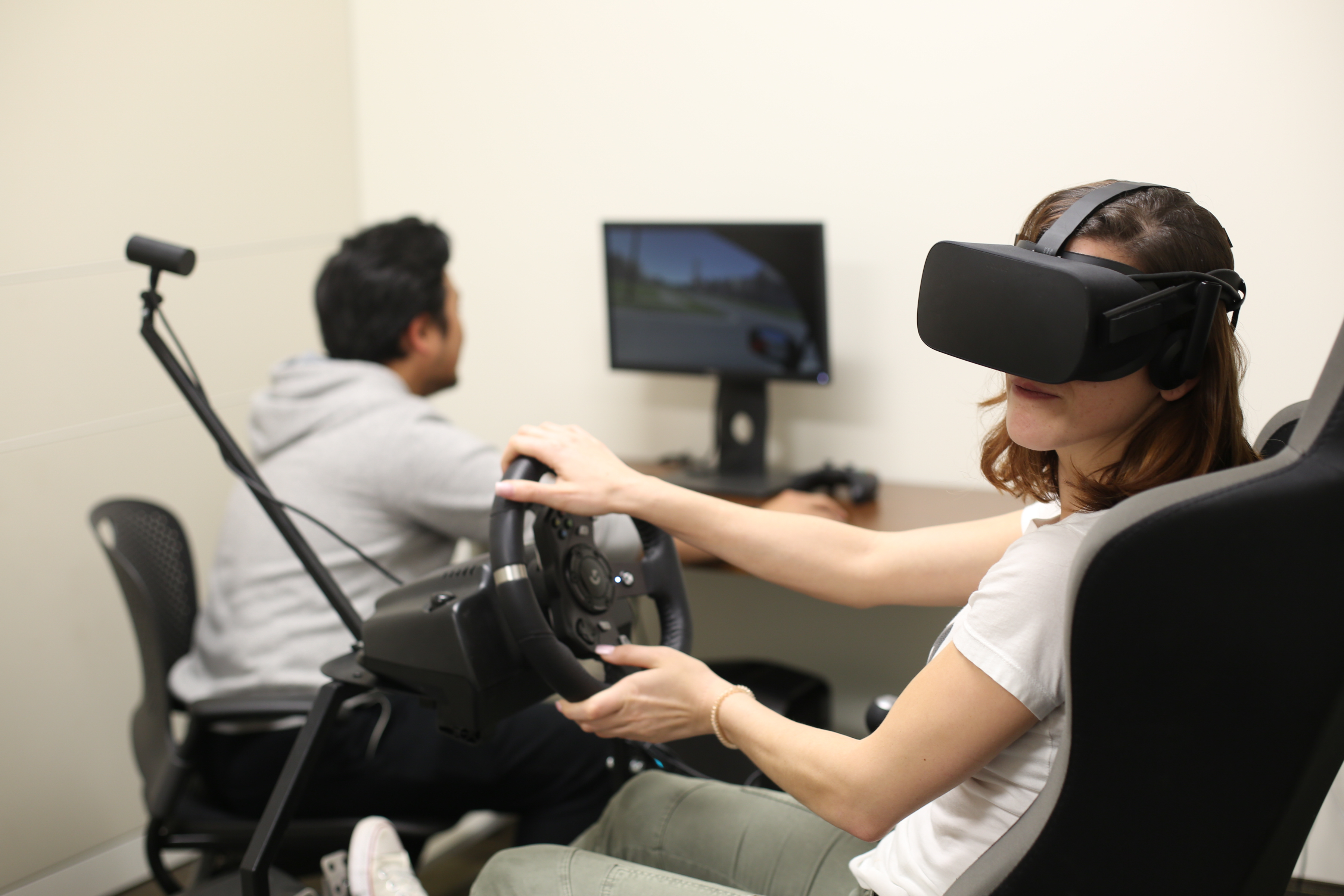 Researcher monitoring activity of a subject utilizing the Driving Simulator.