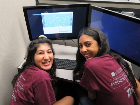 two students at a computer in the lab