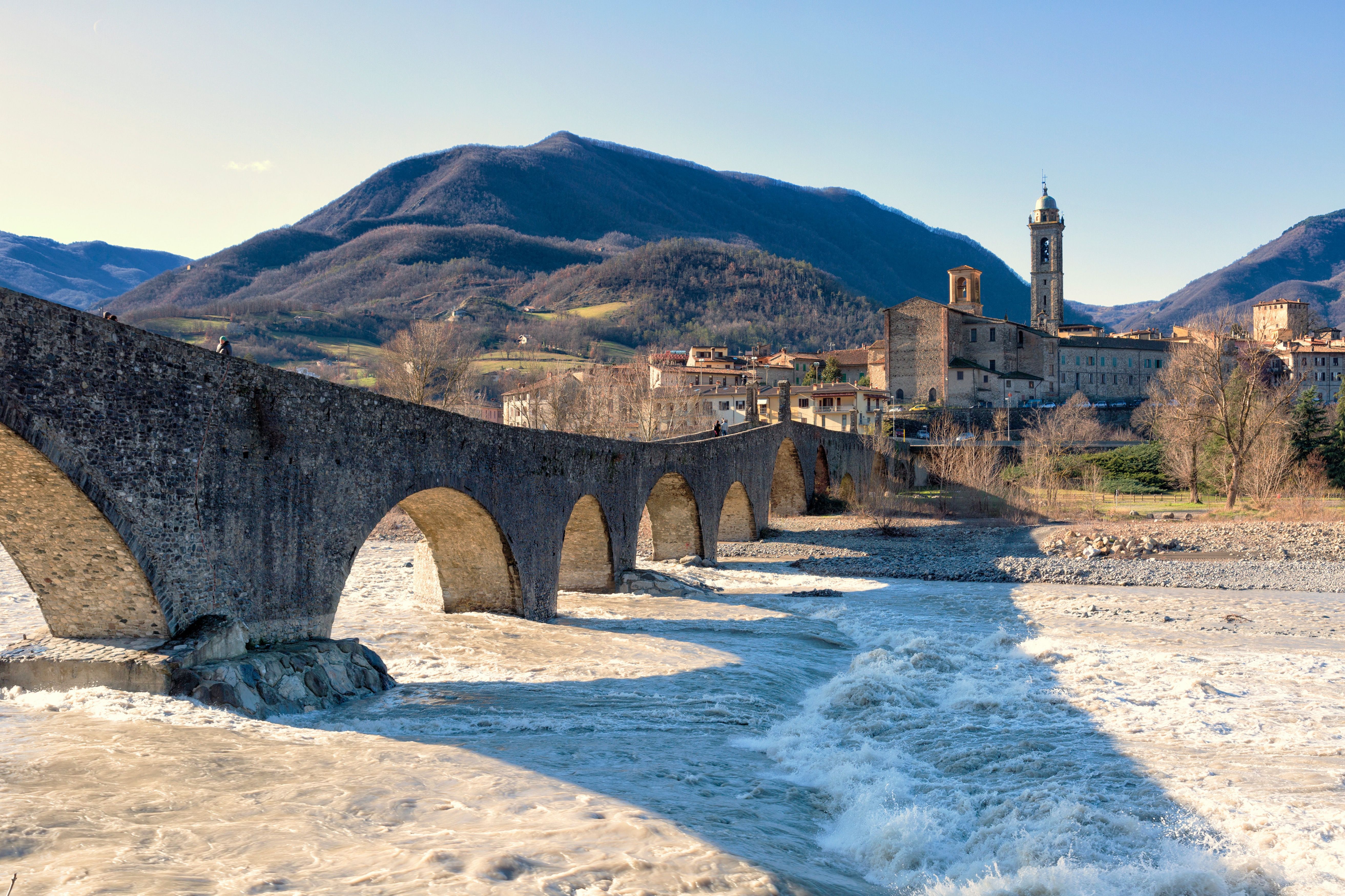 bridge overlooking the mountains in Italy