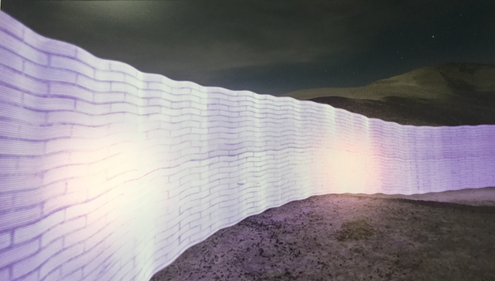 purple light reconstruction of border wall