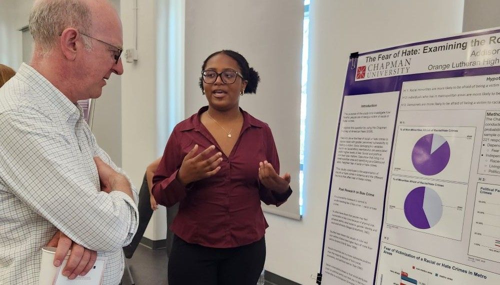 Summer 2026 participant presenting research at the concluding symposium.