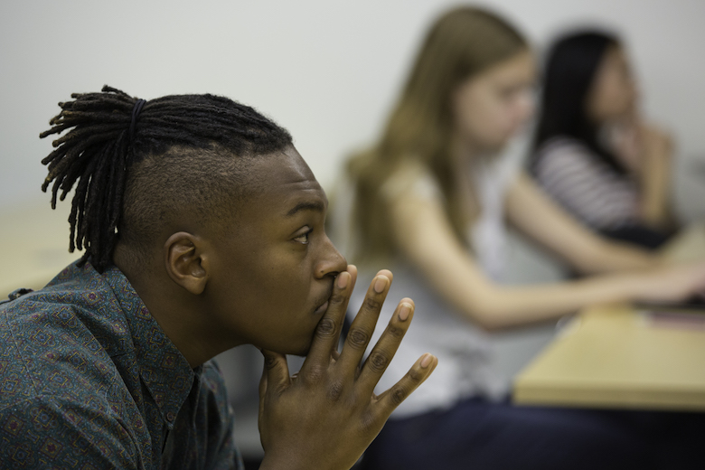 Wilkinson College student listening intently to classmate