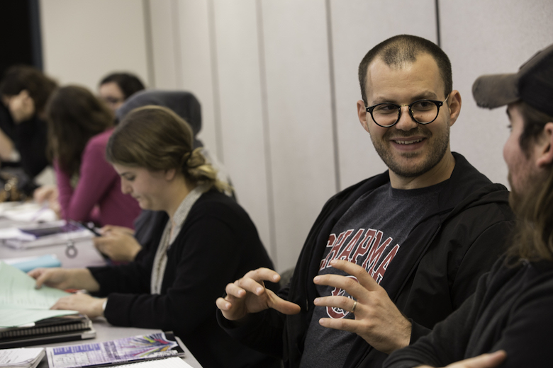 Wilkinson College student listening intently to classmate